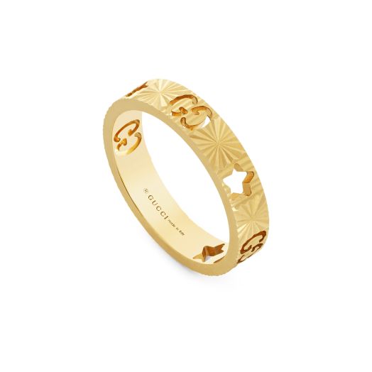 yellow gold ring with interlocking g and star cutouts